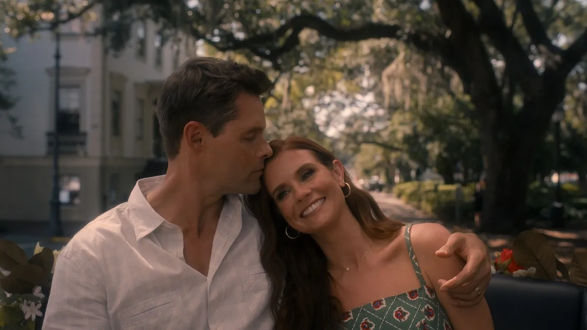 Justin Bruening as Cal kissing Maddie (JoAnna Garcia Swisher) on the head in 'Sweet Magnolias' Season 5