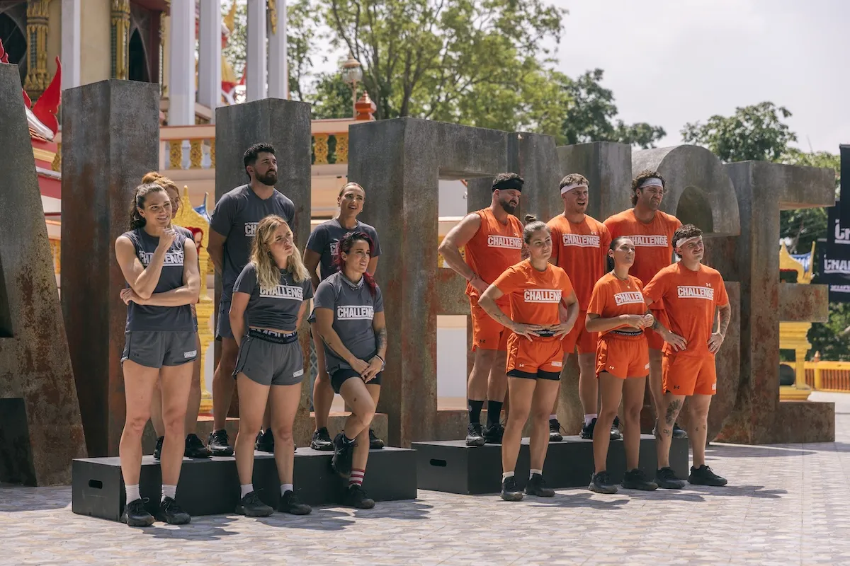 The gray team and orange team standing next to each in an episode of 'The Challenge Cutthroat'