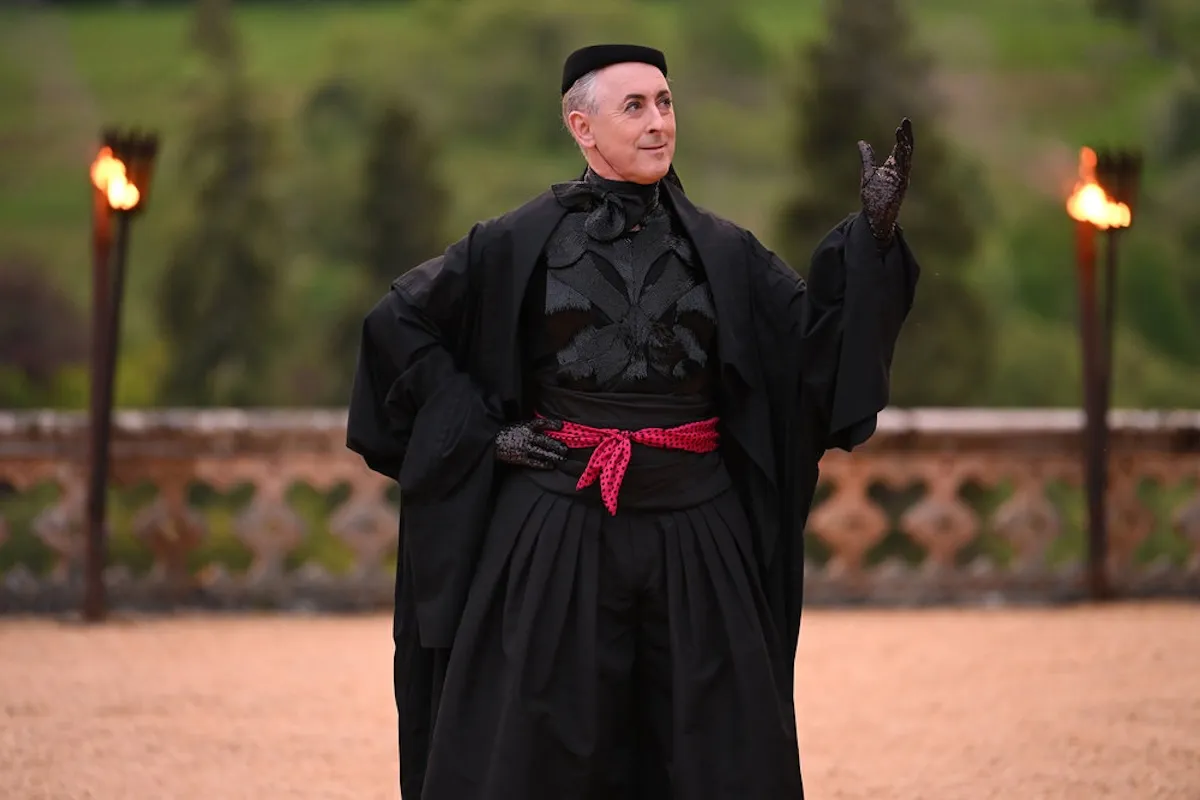 Alan Cumming, dressed in black, in 'The Traitors'