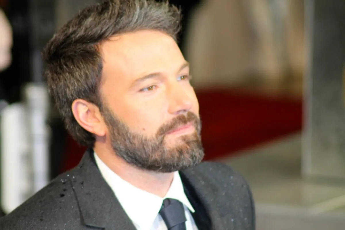 Ben Affleck wears a suit.