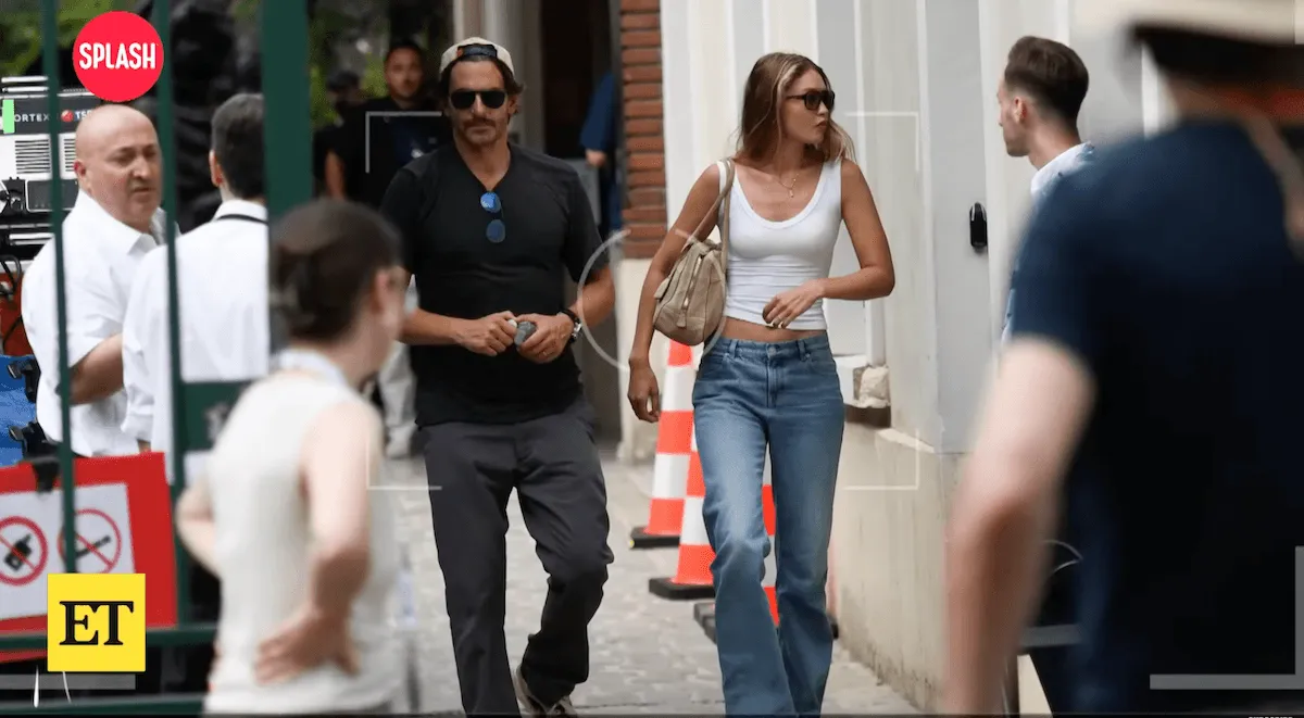 Screenshot of Bradley Cooper and Gigi Hadid walking on a street in Paris