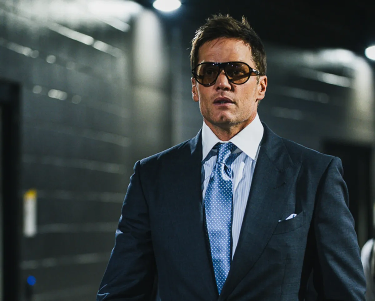 Tom Brady walks into the stadium as the Washington Commanders take on the New York Giants in Week 1 of the 2025 NFL season.