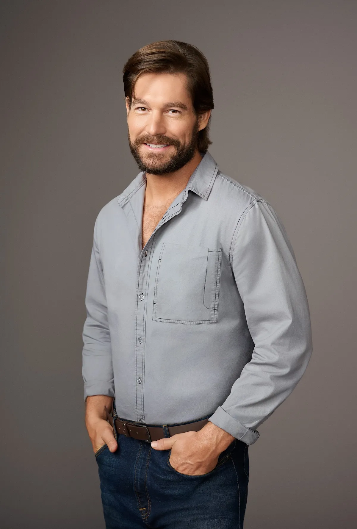 Portrait of Craig Conover in a light gray button-down shirt