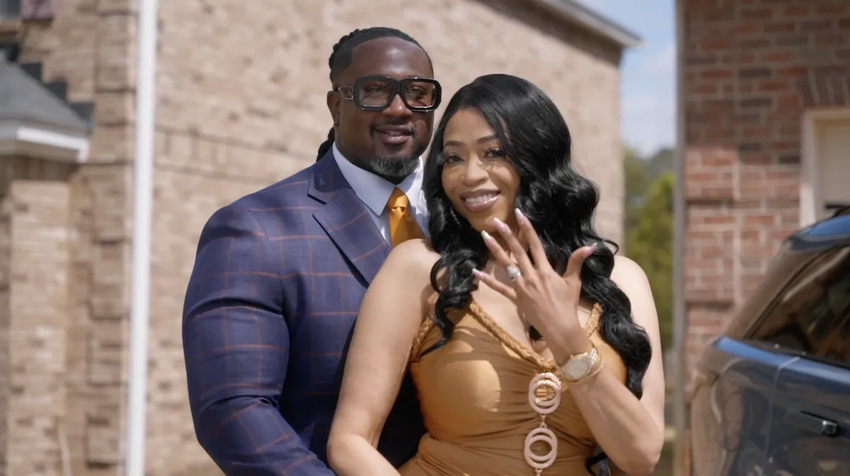 Drew standing behind Janet as she shows off her ring in WeTV's 'Age Inappropriate'