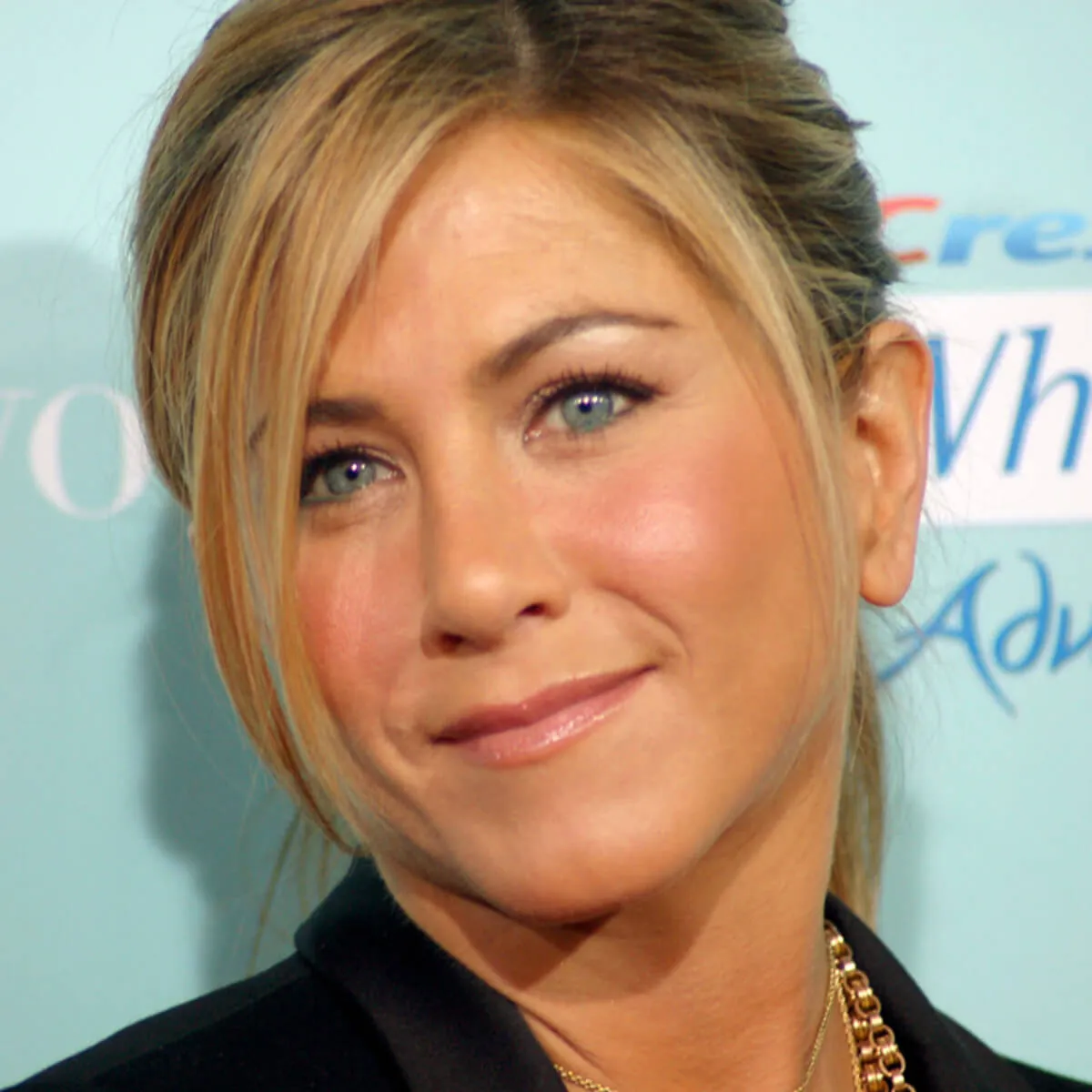 Jennifer Aniston wears a black jacket.