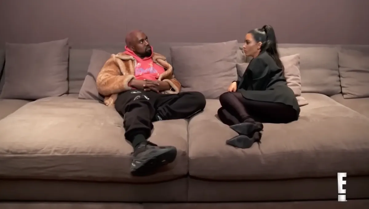 Kanye West and Kim Kardashian sitting on a couch in 'KUWTK'