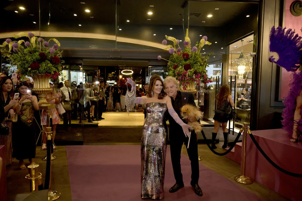 Lisa Vanderpump and Ken Todd pose together. He holds a dog.
