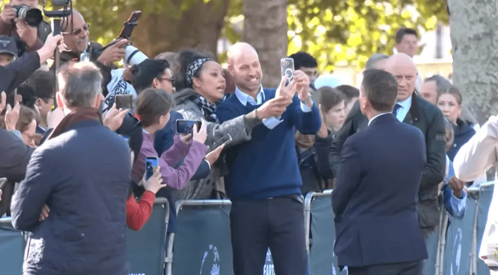 Screenshot of Prince William taking selfie with fan