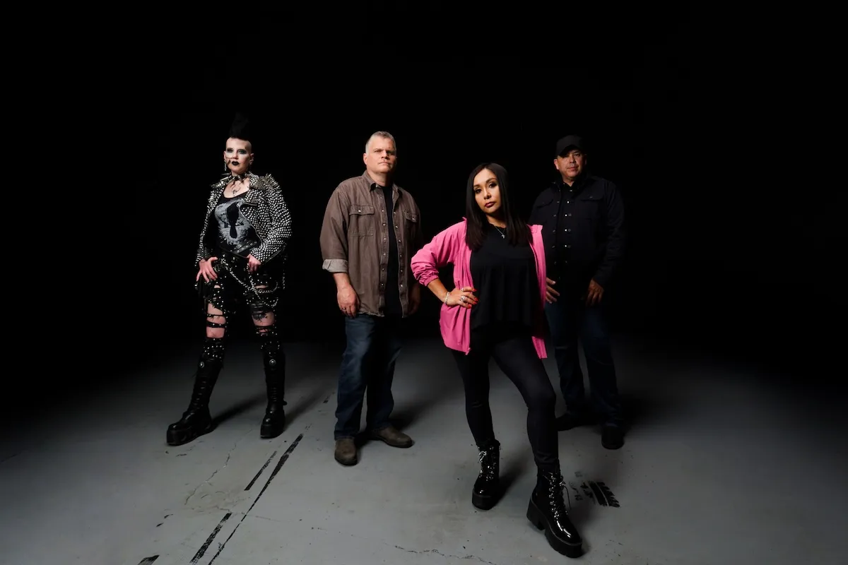 Snooki, in a pink cardigan, with the cast of 'Snooki: The Paranormal Rookie'