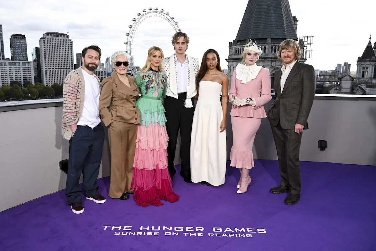 'The Hunger Games: Sunrise on the Reaping' cast poses for a photo on a purple carpet with the London Eye in the background